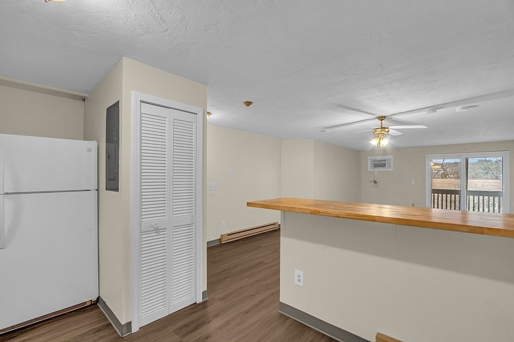 11 Gibbs Street, Unit A6 Worcester, MA 01607 - Photo 10 of 26 an empty room with wooden floor