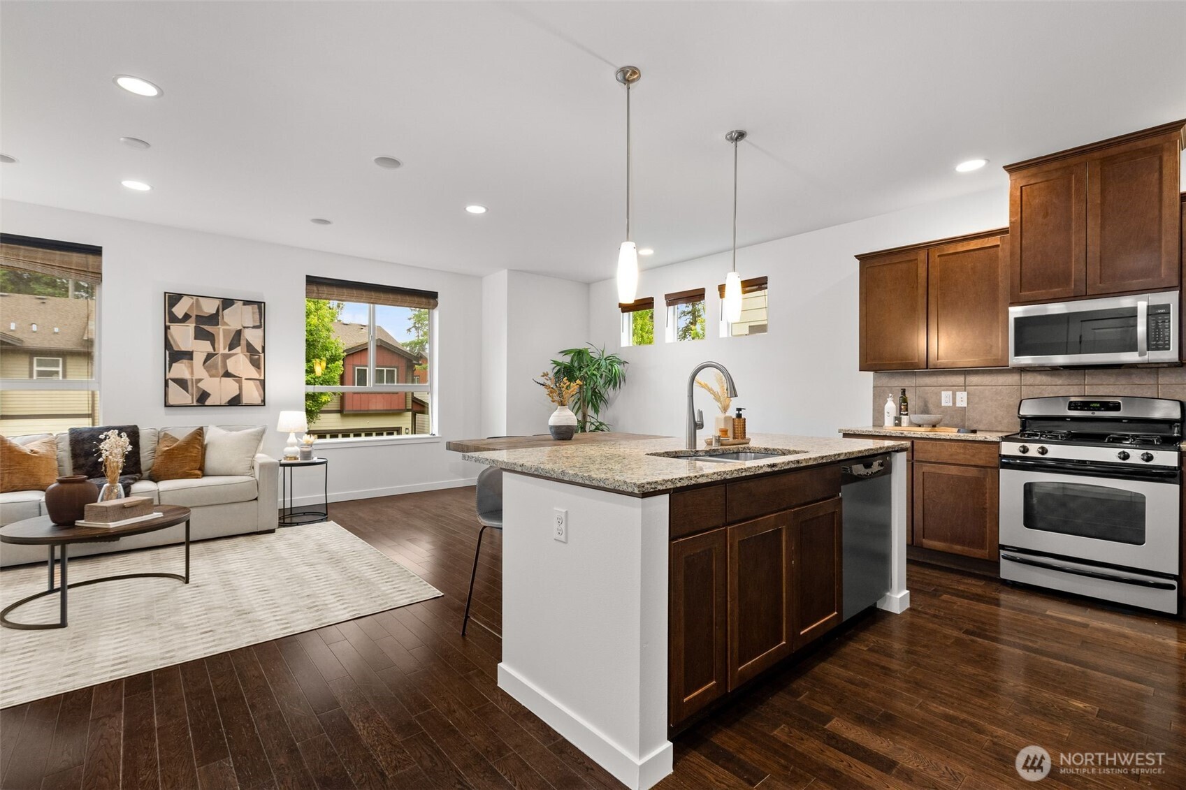 16516 2nd Park Southeast Bothell, WA 98012 - Photo 15 of 39 a kitchen with stainless steel appliances granite countertop a sink stove and wooden floor