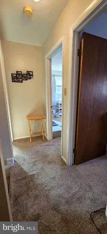 a view of an empty room with windows