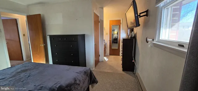 a bathroom with a mirror and a shower