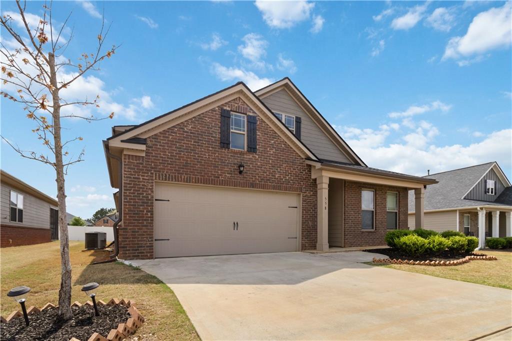 558 Carleton Place Locust Grove, GA 30248 - Photo 1 of 1 a front view of a house with a yard