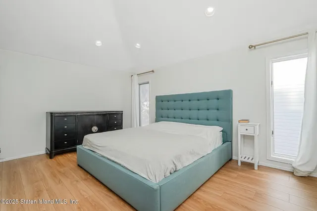 a bed room with a bed and a television