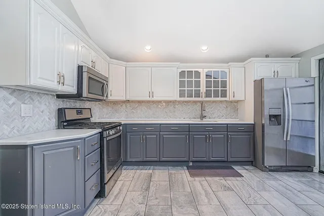 a view of a dining room with furniture and a potted plant