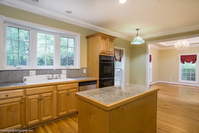 786 McKay Road Gray, GA 31032 - Photo 14 of 39 a kitchen that has a sink and a table in it