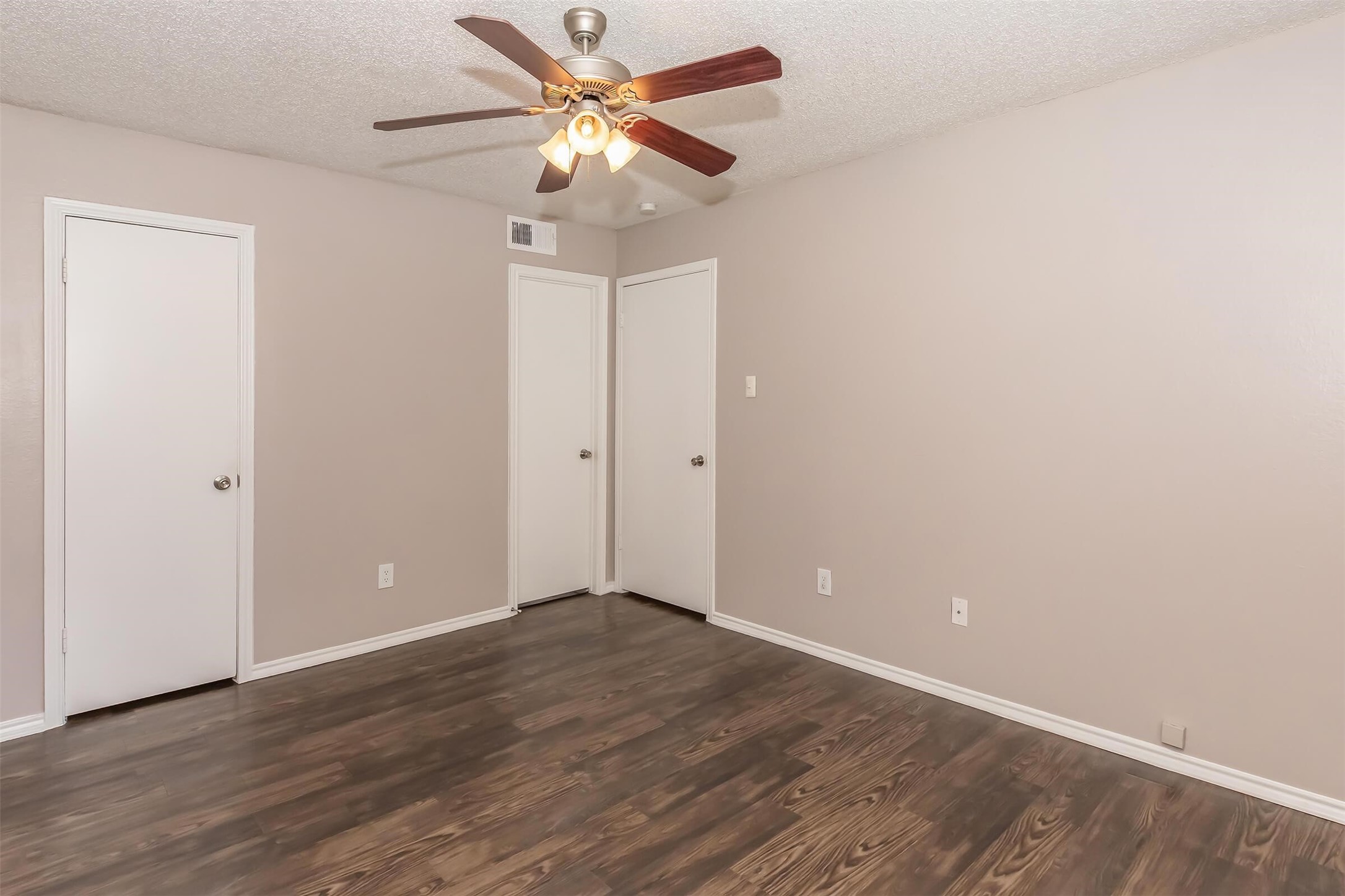 8301 Boat Club Road, Unit 624 Fort Worth, TX 76179 - Photo 6 of 45 an empty room with wooden floor fan and windows