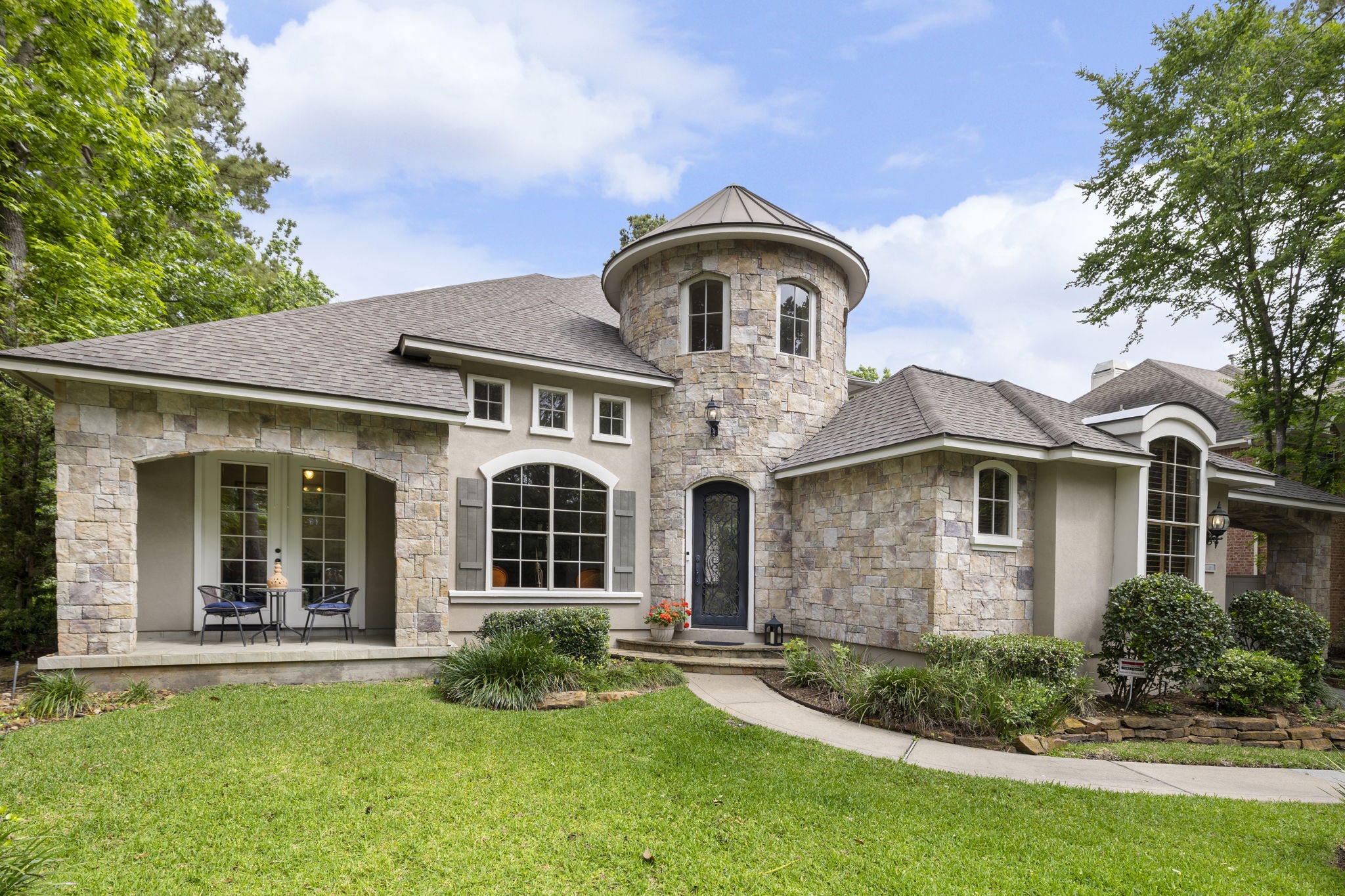 107 East Mirror Ridge Circle The Woodlands, TX 77382 - Photo 1 of 47 front view of a house with a yard