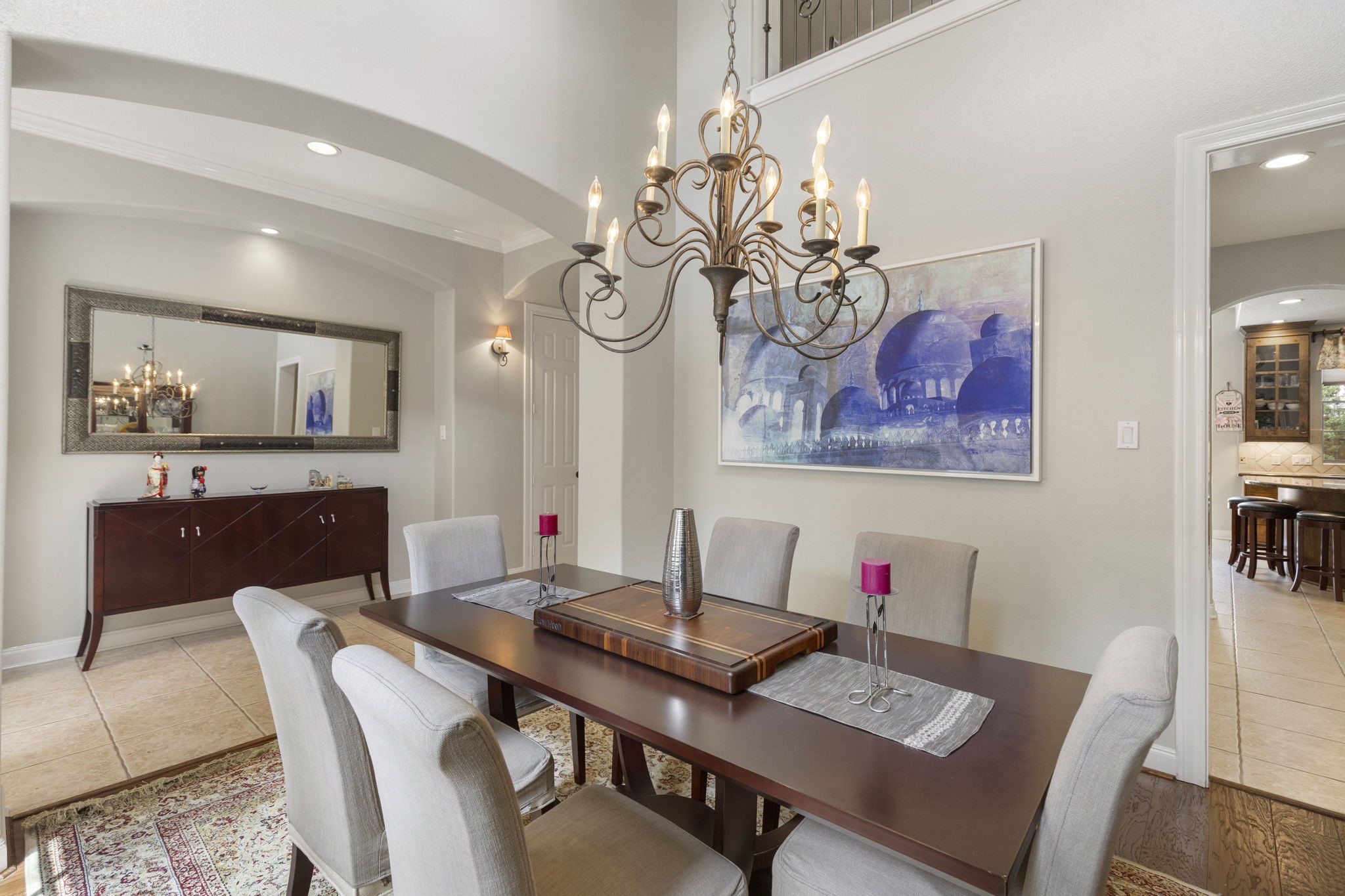 107 East Mirror Ridge Circle The Woodlands, TX 77382 - Photo 15 of 47 a view of a dining room with furniture a chandelier and wooden floor