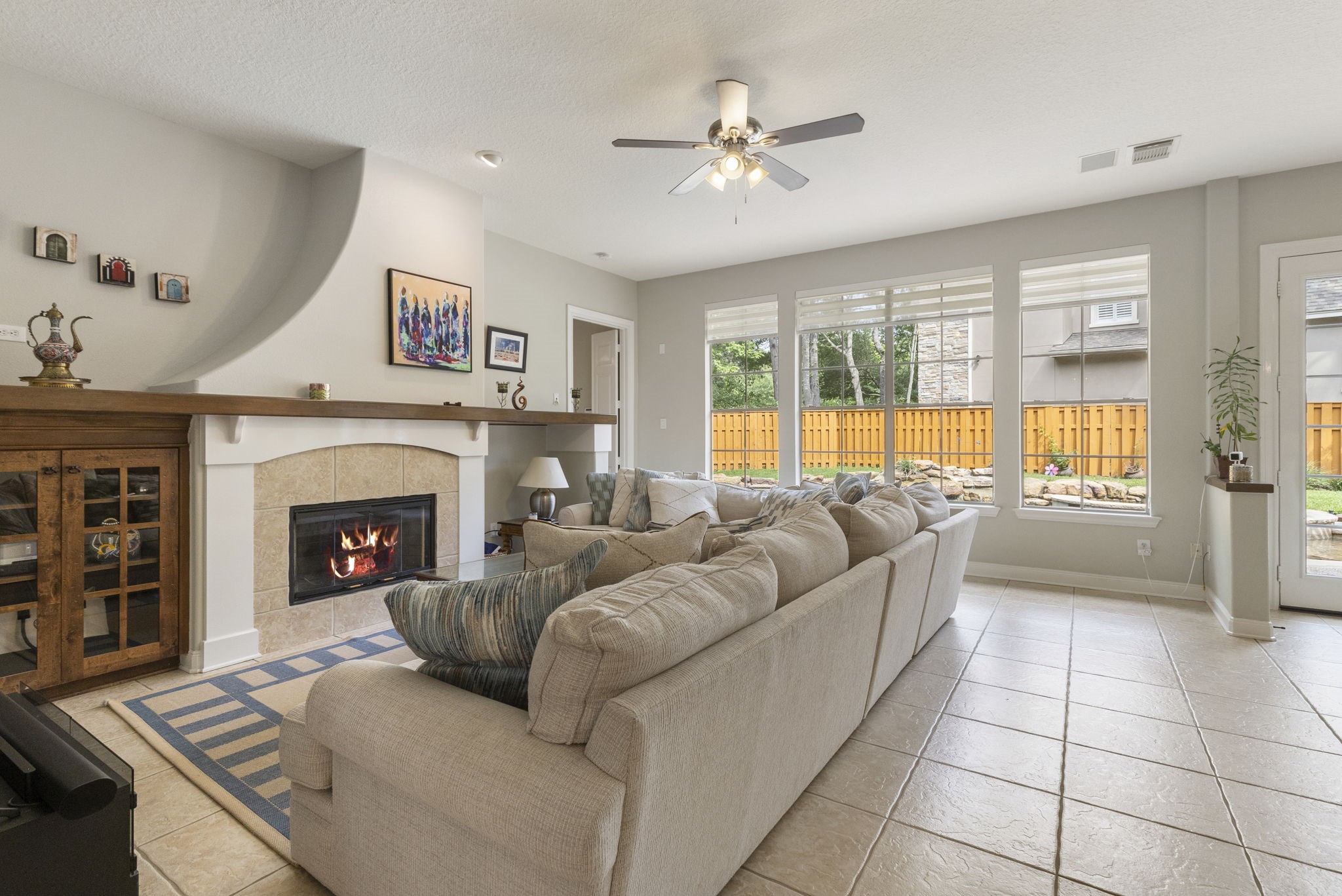 107 East Mirror Ridge Circle The Woodlands, TX 77382 - Photo 16 of 47 a living room with furniture and a fireplace