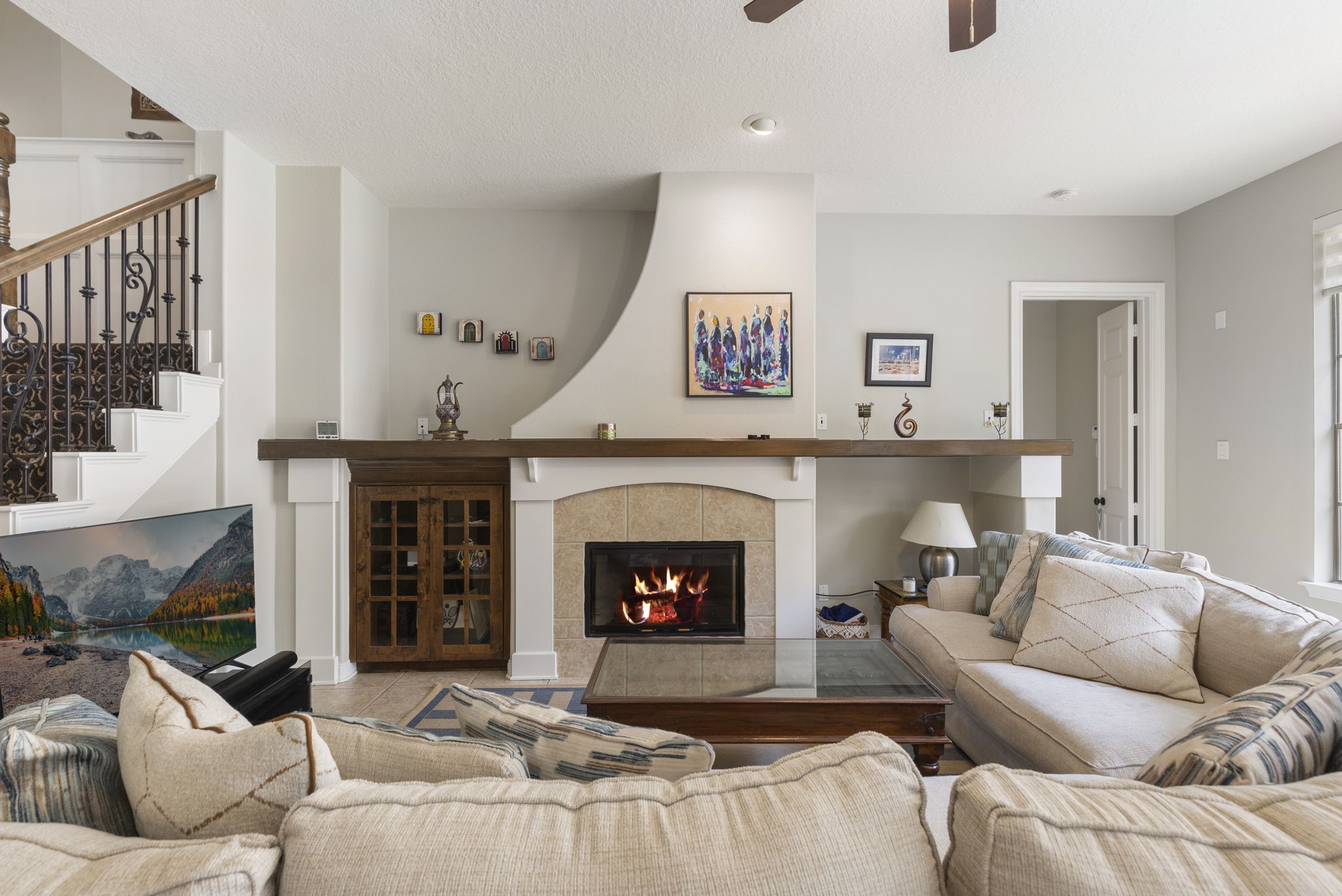 107 East Mirror Ridge Circle The Woodlands, TX 77382 - Photo 17 of 47 a living room with furniture and a fireplace