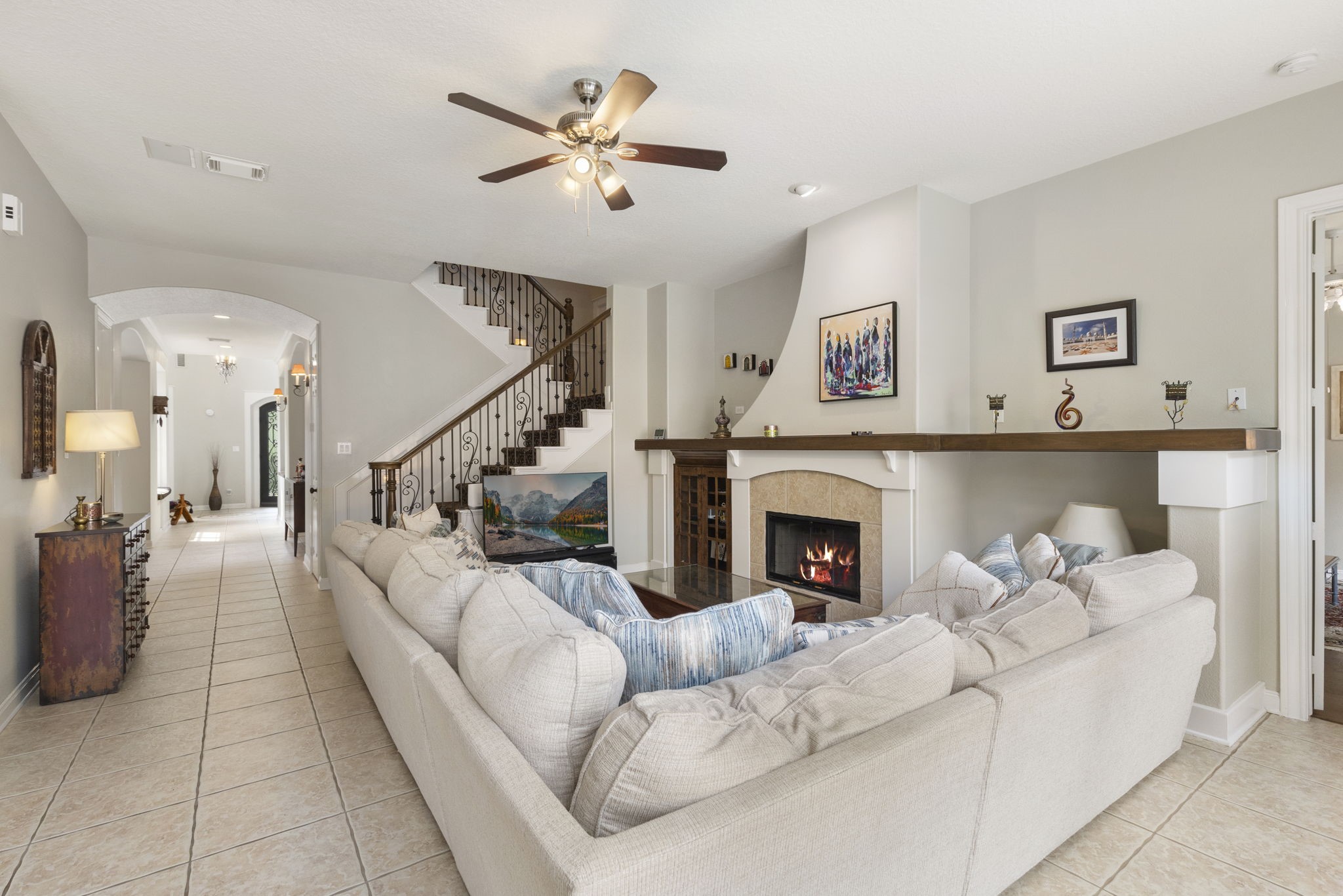 107 East Mirror Ridge Circle The Woodlands, TX 77382 - Photo 18 of 47 a living room with furniture and a fireplace