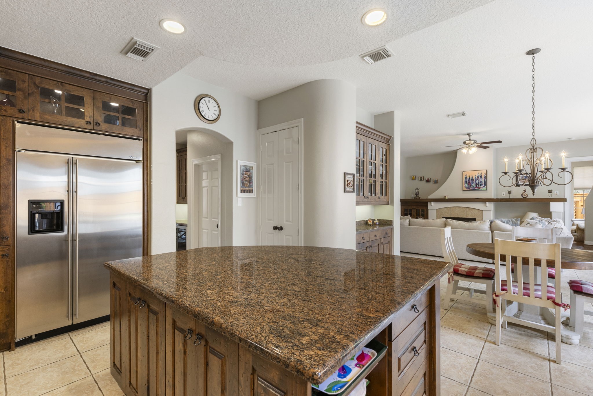 107 East Mirror Ridge Circle The Woodlands, TX 77382 - Photo 24 of 47 a kitchen with granite countertop a counter top space and stainless steel appliances
