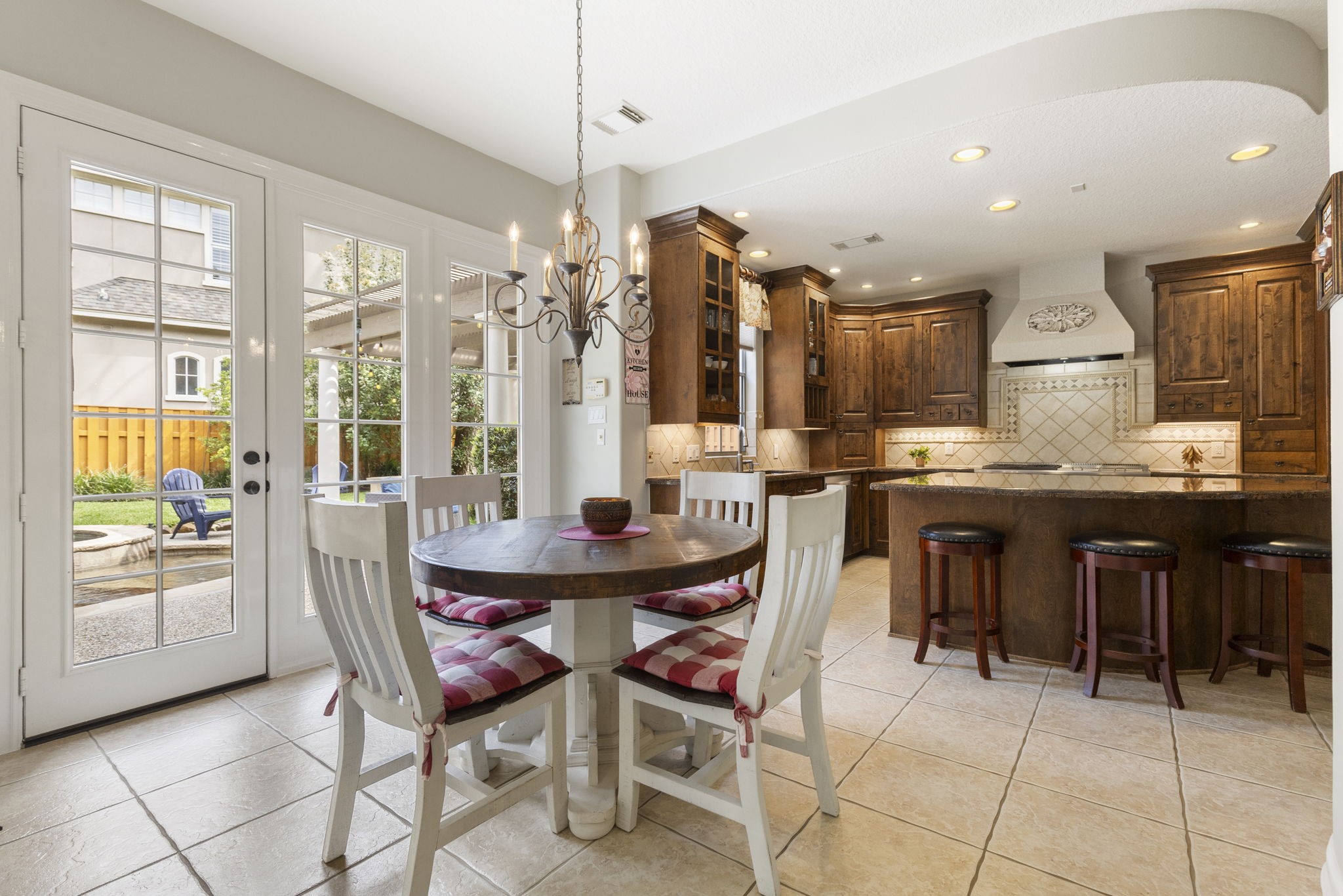 107 East Mirror Ridge Circle The Woodlands, TX 77382 - Photo 26 of 47 a view of a dining room with furniture window and outside view