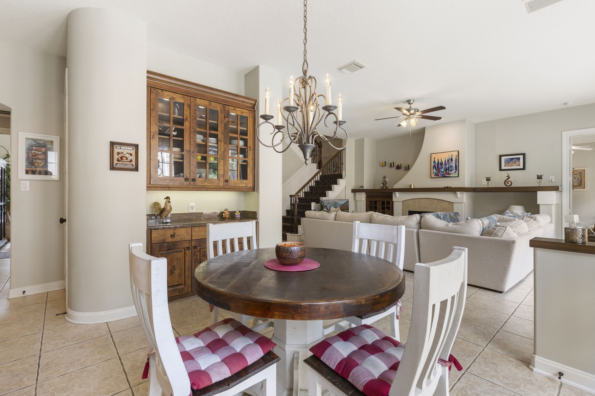 107 East Mirror Ridge Circle The Woodlands, TX 77382 - Photo 27 of 47 a view of a dining room with furniture and chandelier