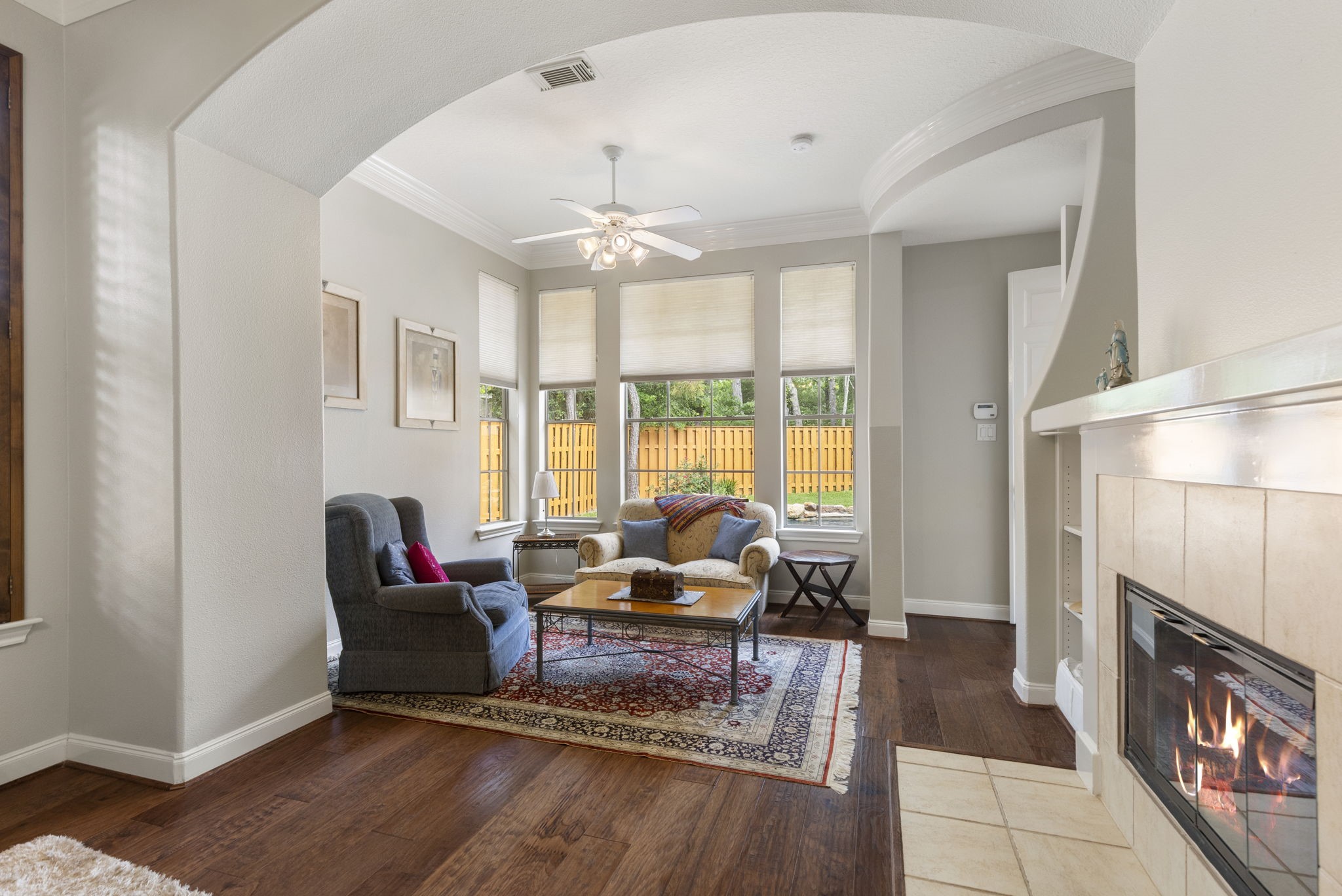 107 East Mirror Ridge Circle The Woodlands, TX 77382 - Photo 29 of 47 a living room with furniture and a fireplace