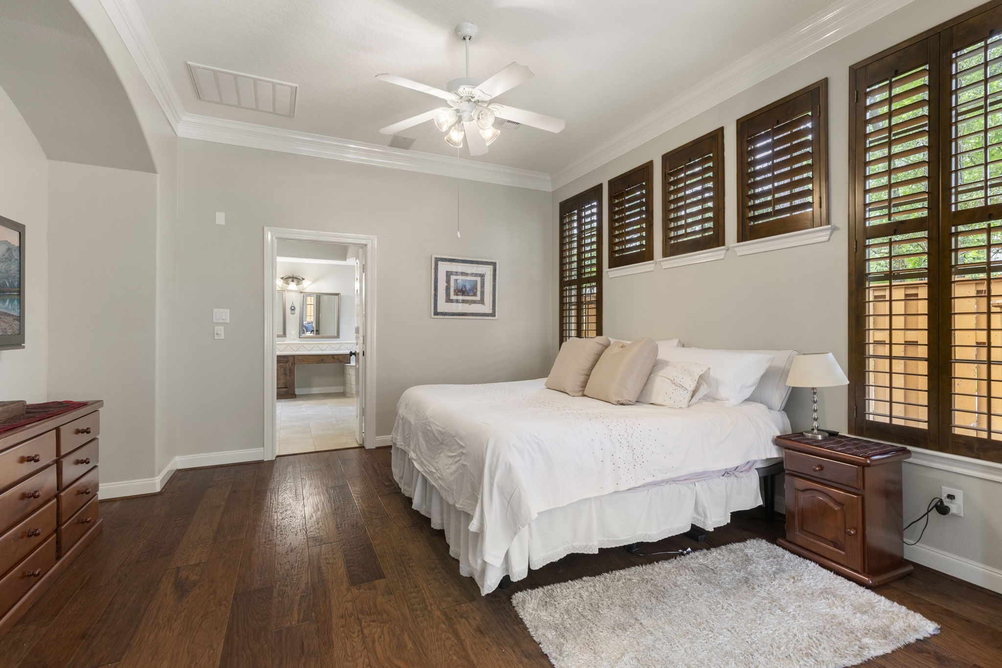 107 East Mirror Ridge Circle The Woodlands, TX 77382 - Photo 30 of 47 a bedroom with a large bed and a window