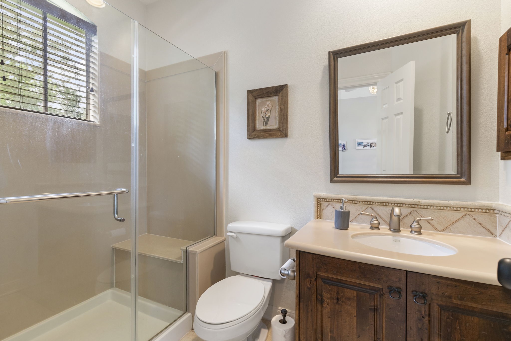 107 East Mirror Ridge Circle The Woodlands, TX 77382 - Photo 35 of 47 a bathroom with a granite countertop sink toilet and shower