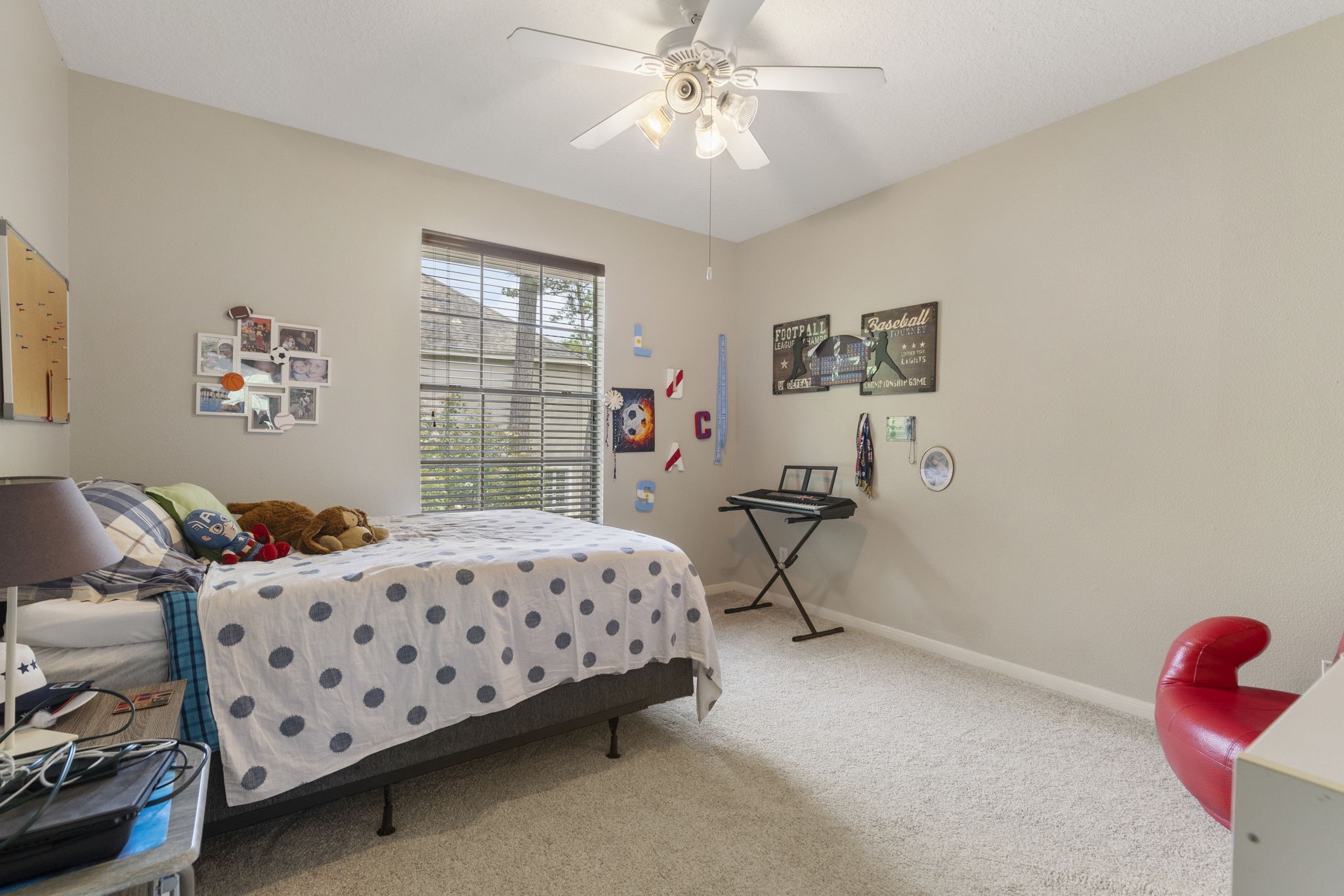 107 East Mirror Ridge Circle The Woodlands, TX 77382 - Photo 36 of 47 a bedroom with bed and a window