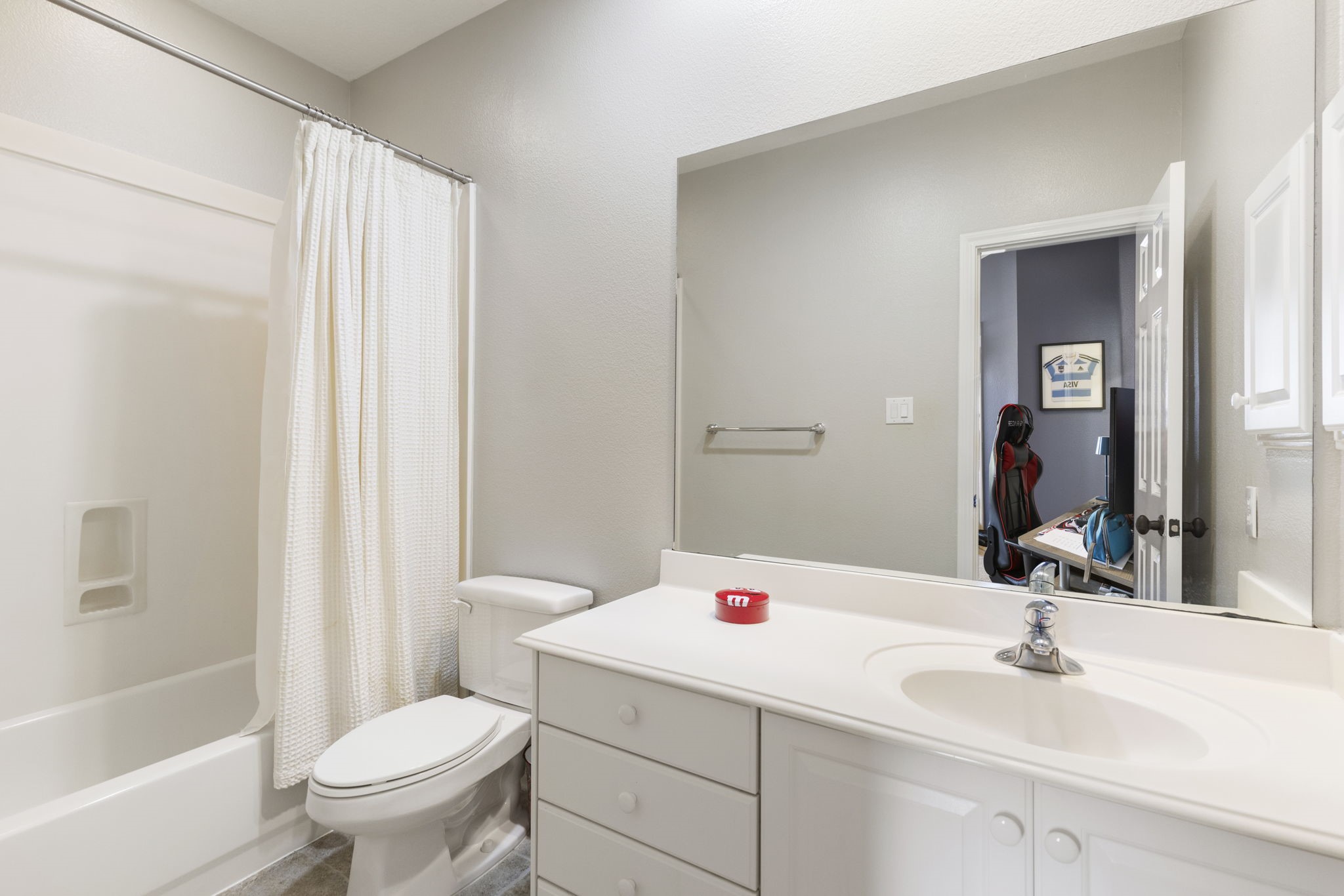 107 East Mirror Ridge Circle The Woodlands, TX 77382 - Photo 39 of 47 a bathroom with a sink and a mirror