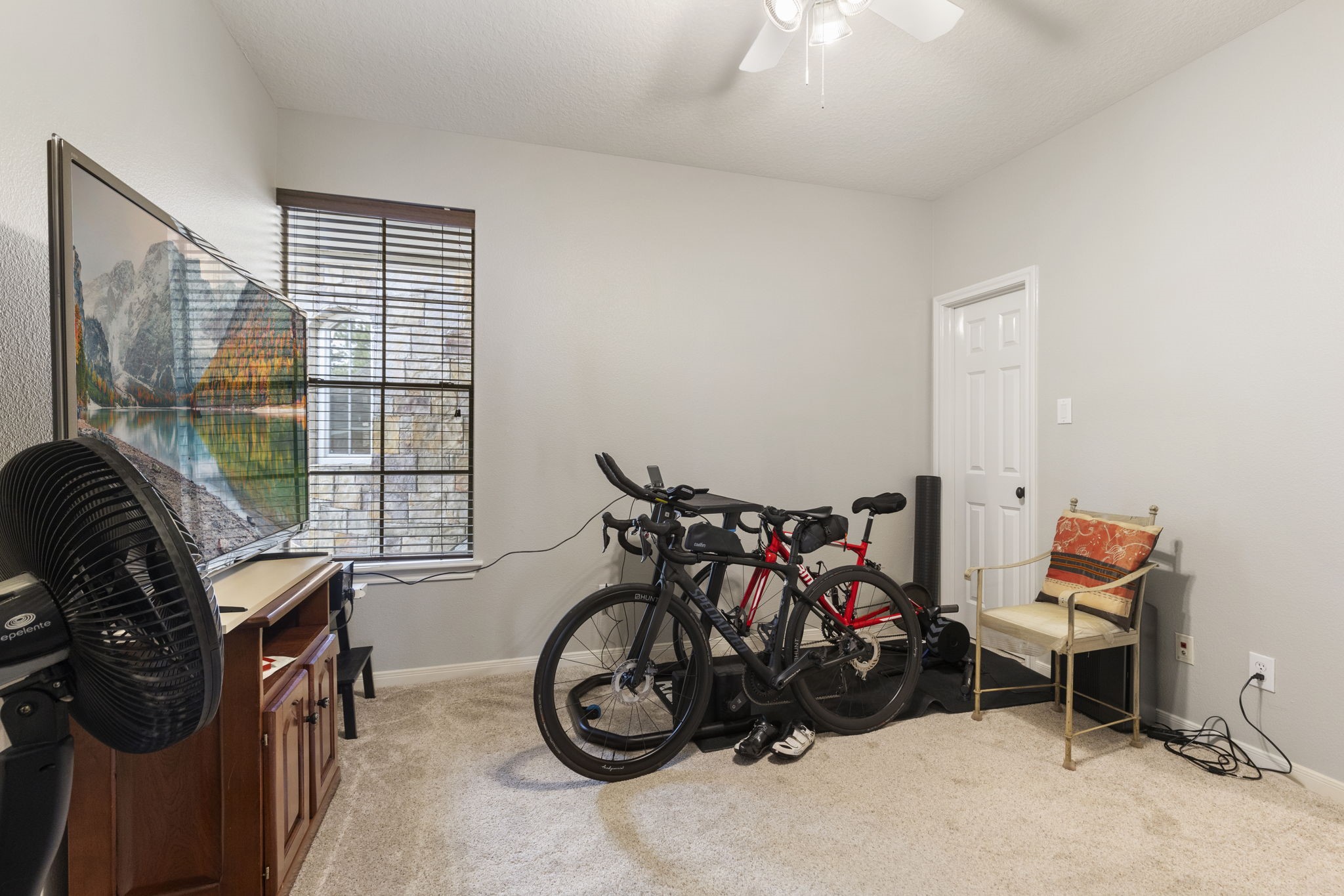 107 East Mirror Ridge Circle The Woodlands, TX 77382 - Photo 40 of 47 a view of a room with gym equipment