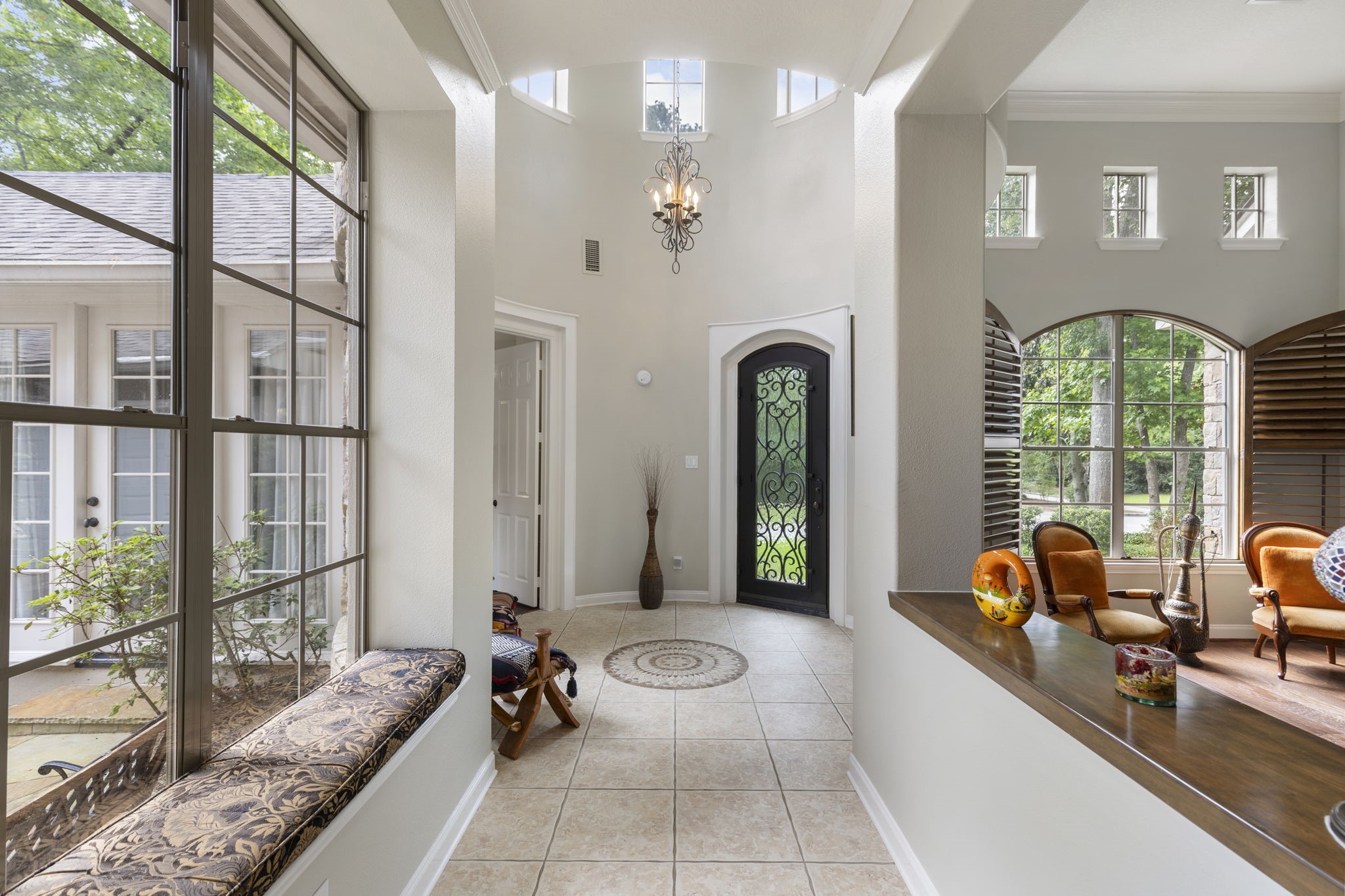 107 East Mirror Ridge Circle The Woodlands, TX 77382 - Photo 10 of 47 a lobby with furniture and floor to ceiling windows