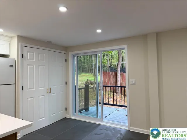 a view of entryway with wooden floor