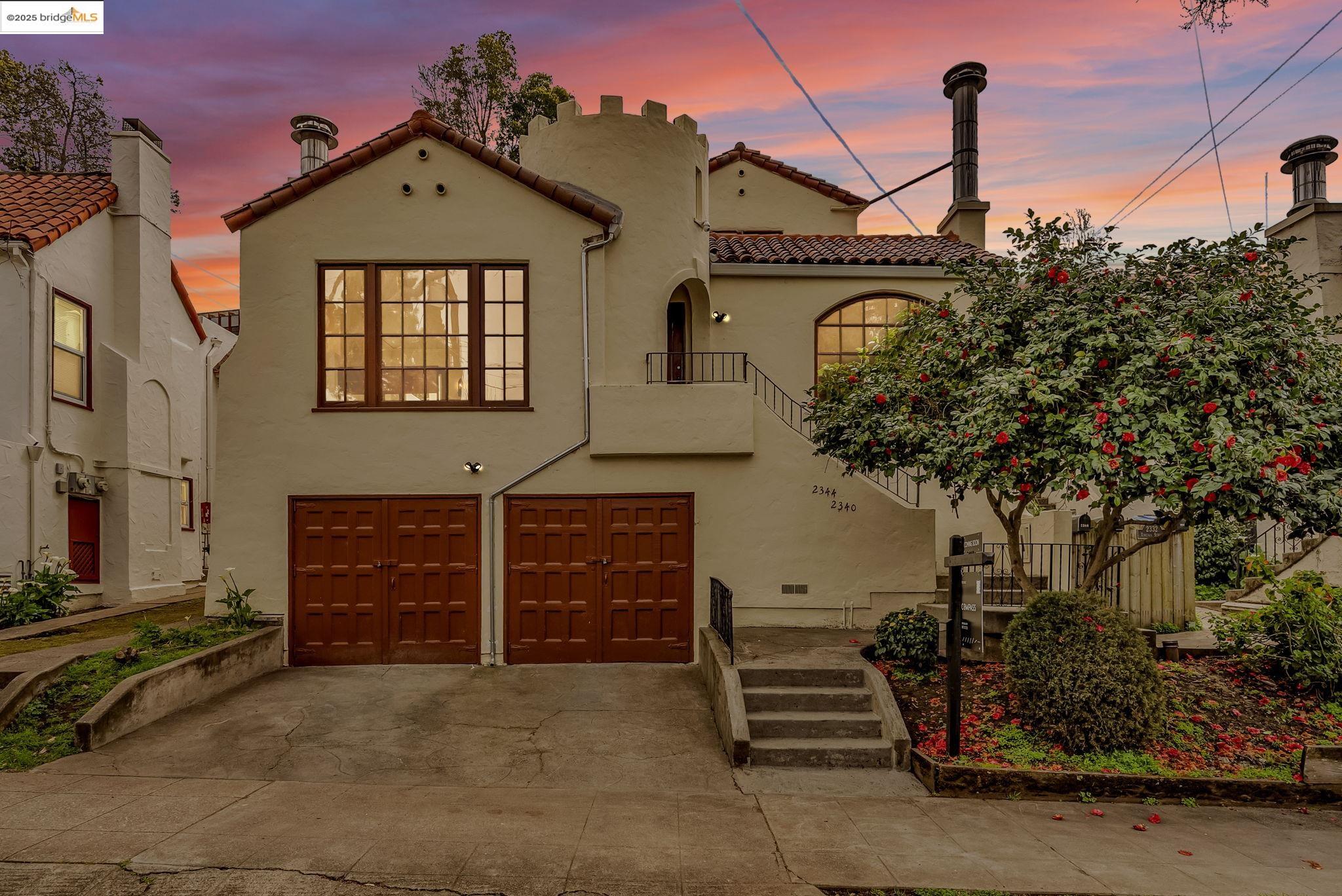 a front view of a house with a garage