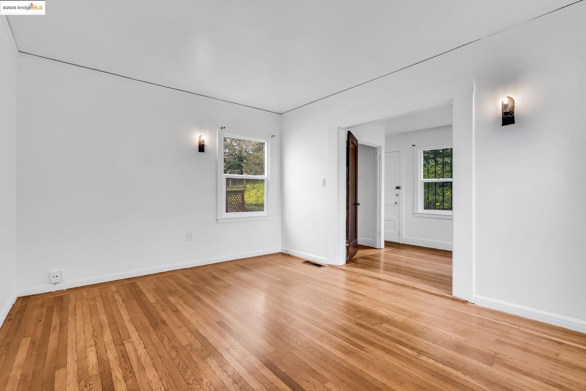 2340 Virginia Street Berkeley, CA 94709 - Photo 21 of 56 an empty room with wooden floor and windows