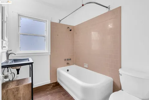 a bathroom with a bathtub and a toilet