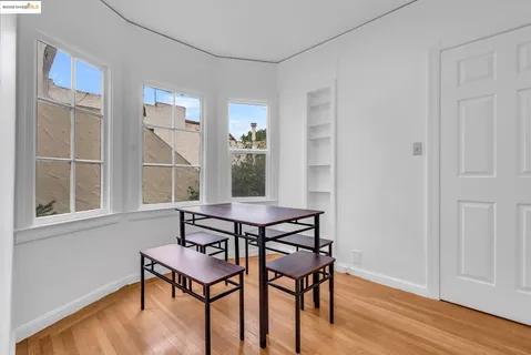 a view of a room that has a table and a chair
