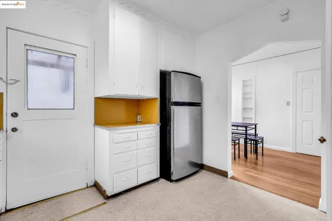 a view of a livingroom with furniture and a dresser
