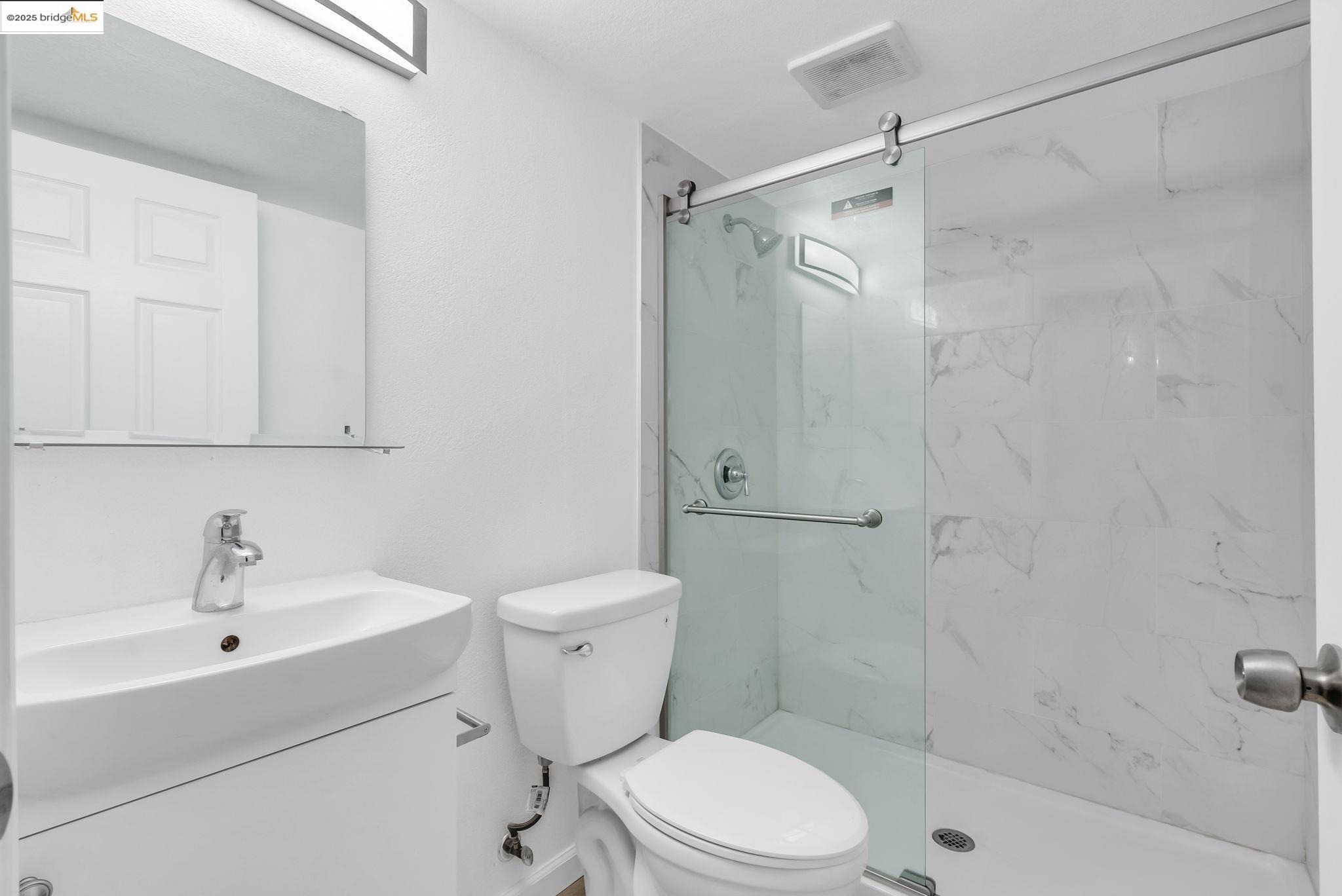 2340 Virginia Street Berkeley, CA 94709 - Photo 43 of 56 a white toilet sitting next to a bath tub shower