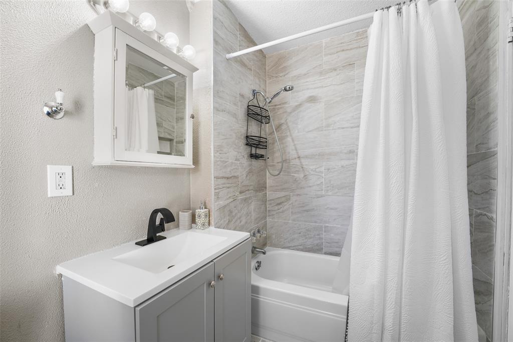 1145 Jefferson Road Paris, TX 75460 - Photo 15 of 17 a bathroom with a sink a toilet and shower