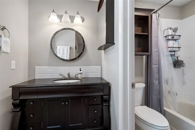 a bedroom with a bed and a desk