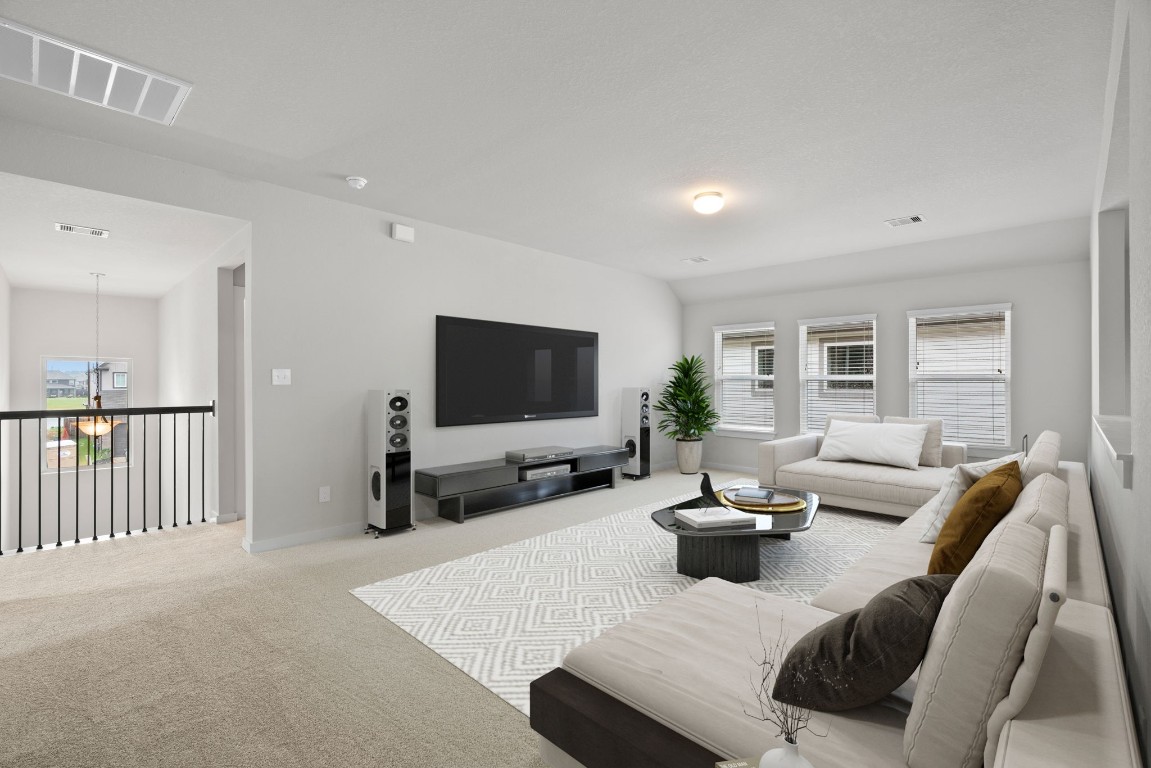 15711 Telge Ridge Lane Cypress, TX 77429 - Photo 11 of 20 a living room with furniture and a flat screen tv