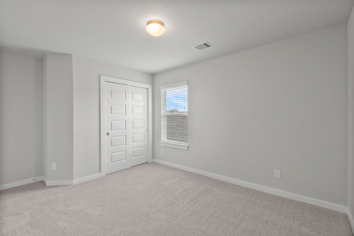 15711 Telge Ridge Lane Cypress, TX 77429 - Photo 13 of 20 an empty room with windows and closet