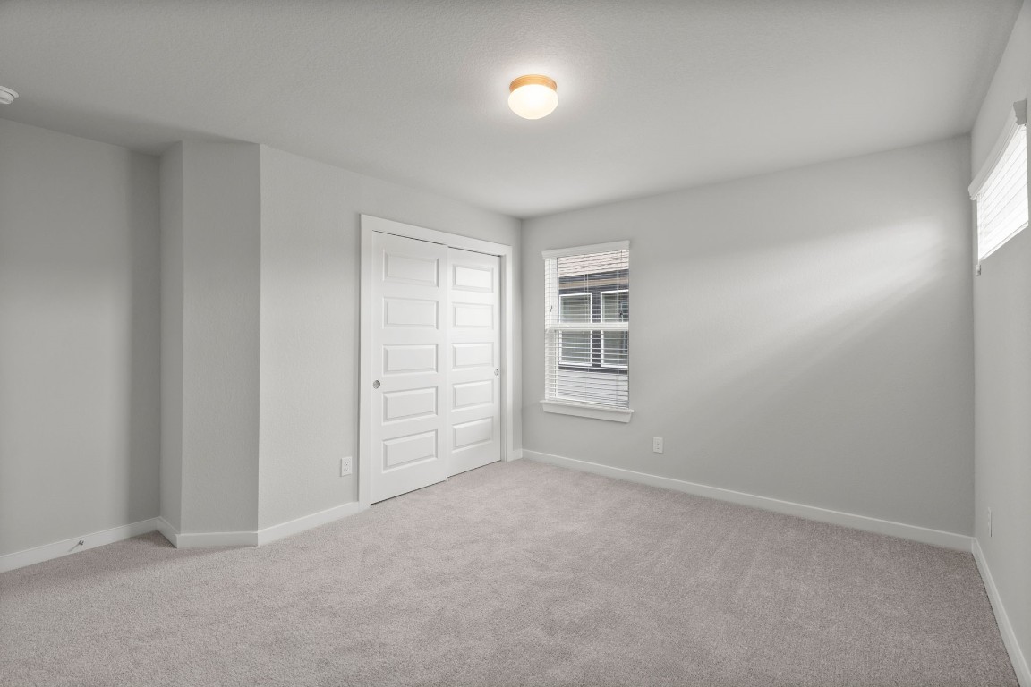 15711 Telge Ridge Lane Cypress, TX 77429 - Photo 15 of 20 an empty room with windows and closet