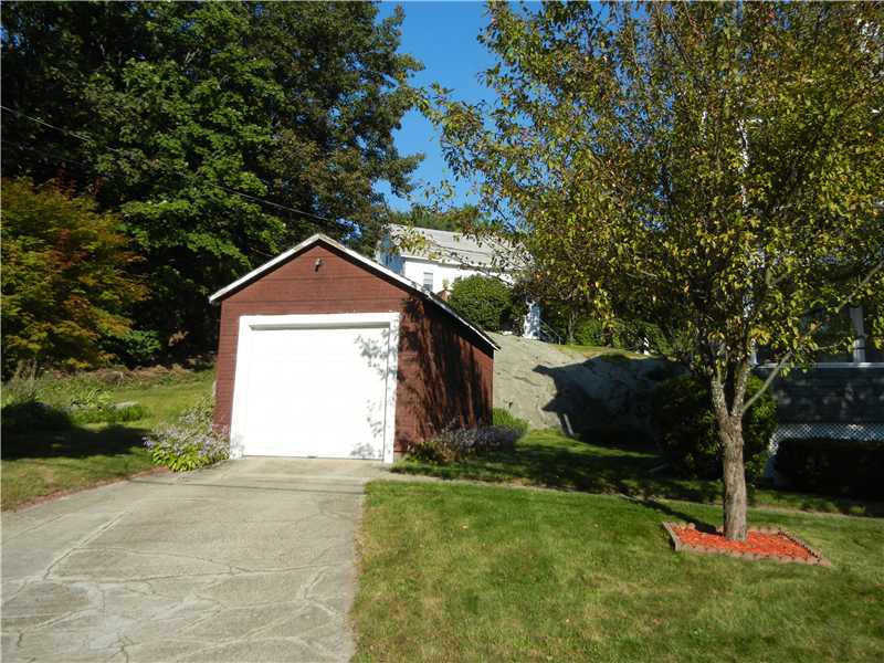 350 Knight Street Woonsocket, RI 02895 - Photo 3 of 23 Parking Lot/Garage. One-car garage with view of cottage in rear