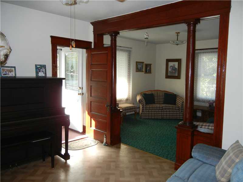 350 Knight Street Woonsocket, RI 02895 - Photo 5 of 23 Living Room. Spacious double living room with high ceilings that leads out to private porch.