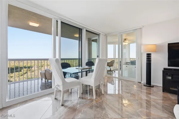 a view of a dining room with furniture window and outside view