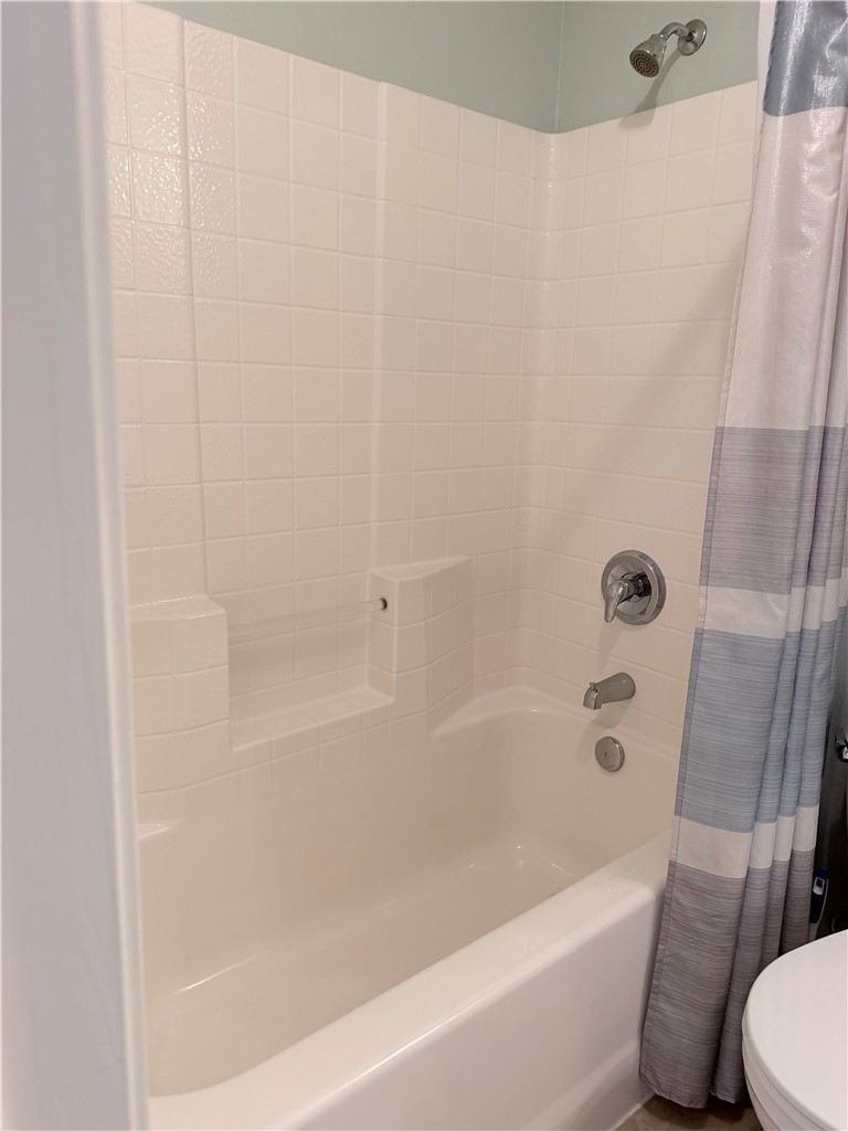 1029 Fallbrook Loop College Station, TX 77845 - Photo 23 of 34 a bathroom with a bathtub and a toilet
