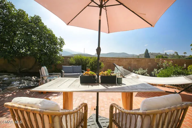 a view of an outdoor sitting area with furniture