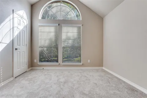 an empty room with a fireplace