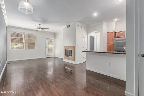 a kitchen with stainless steel appliances granite countertop a refrigerator a sink and a stove
