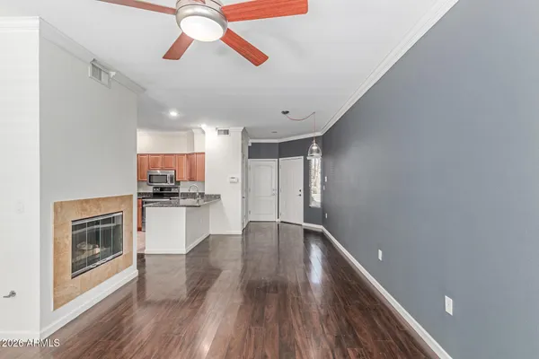 a kitchen with granite countertop a refrigerator stove and microwave