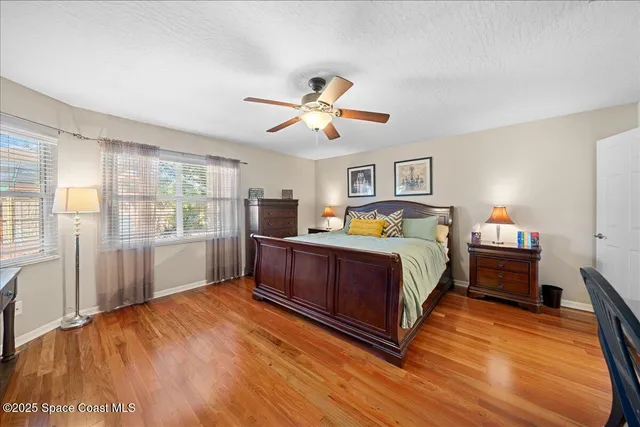 a bed room with furniture and wooden floor