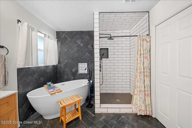 a bathroom with 2 sink and a mirror