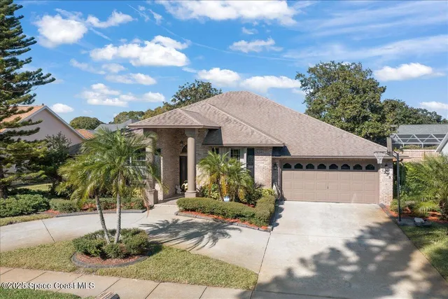 an aerial view of a house with outdoor space