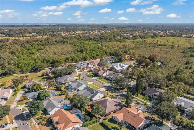 an aerial view of a city and mountain view in back
