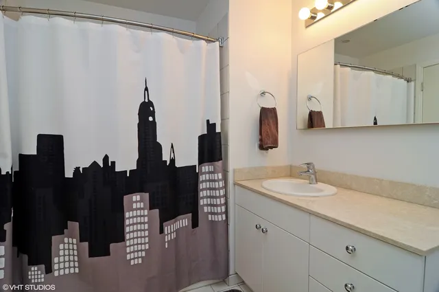 a bathroom with a double vanity sink and mirror