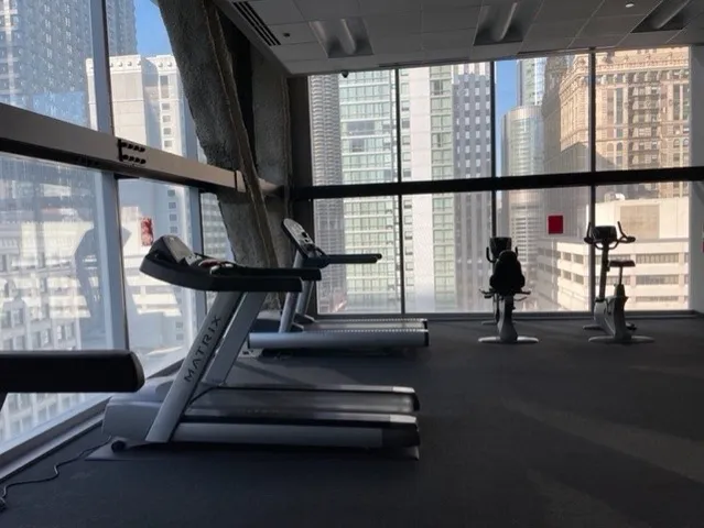 a view of entryway with wooden floor and windows